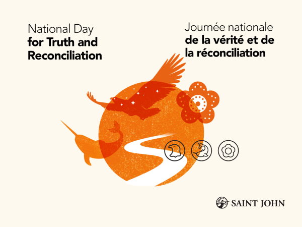 A group of people participating in a walk for Truth and Reconciliation.