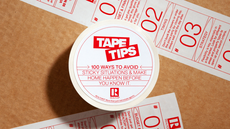A roll of packing tape with real estate tips printed on it.