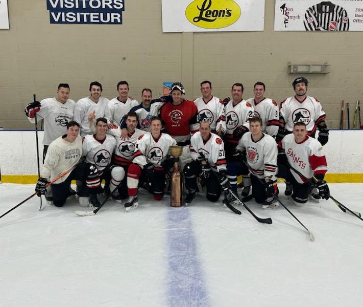 Saint John Firefighters team posing with the championship trophy.
