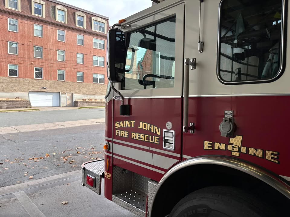 Saint John firefighters on the scene of an apartment fire on Prince William Street.