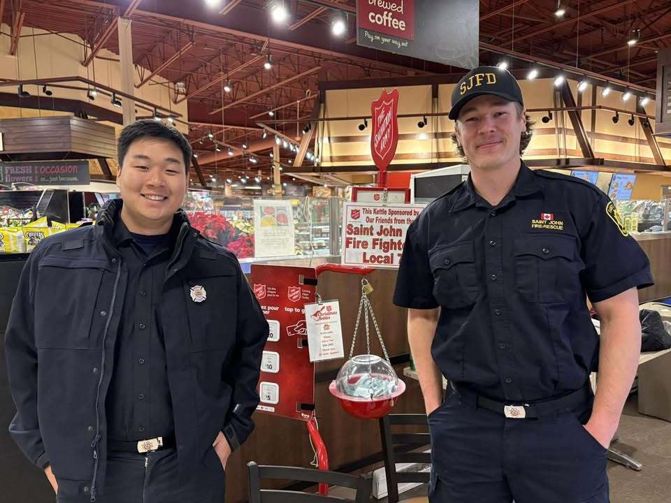 Saint John Firefighters posing for a group photo while fundraising for the Salvation Army.