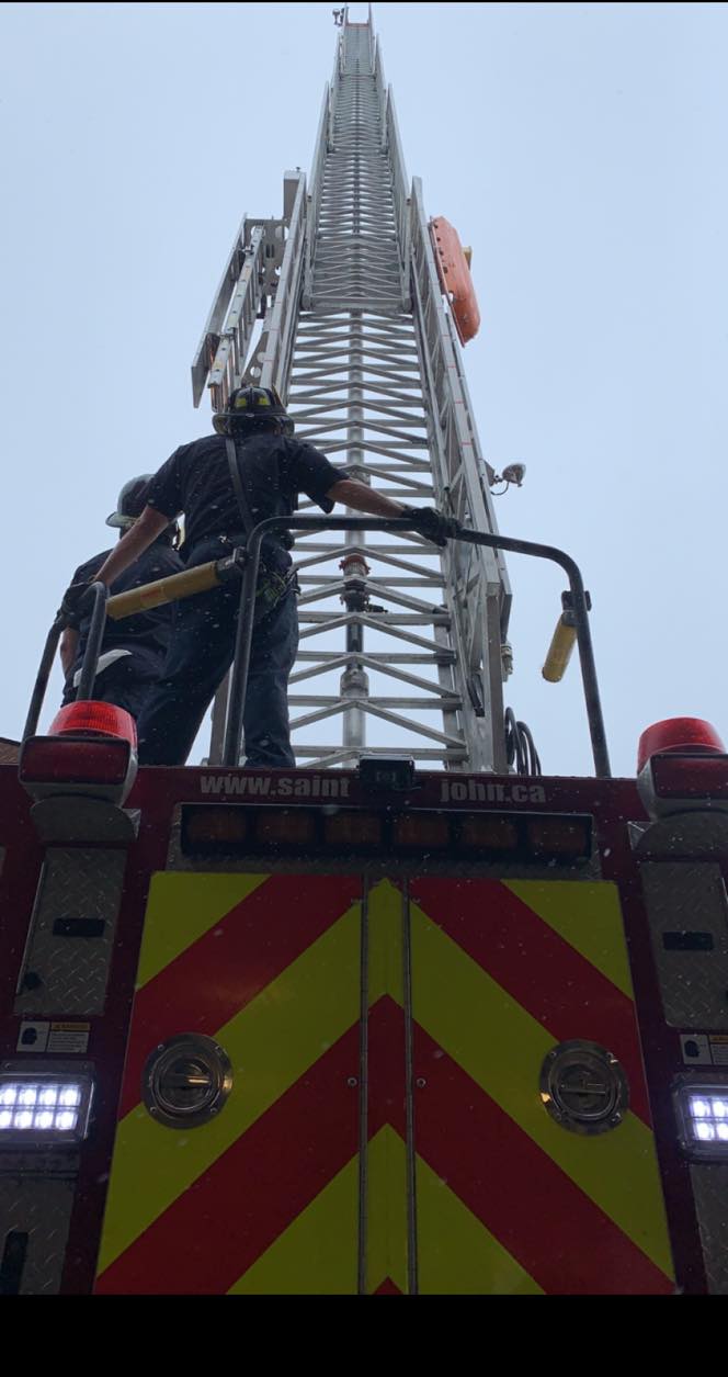 Ladder 5 from Saint John Fire Station 5 with its 100-foot aerial ladder extended.