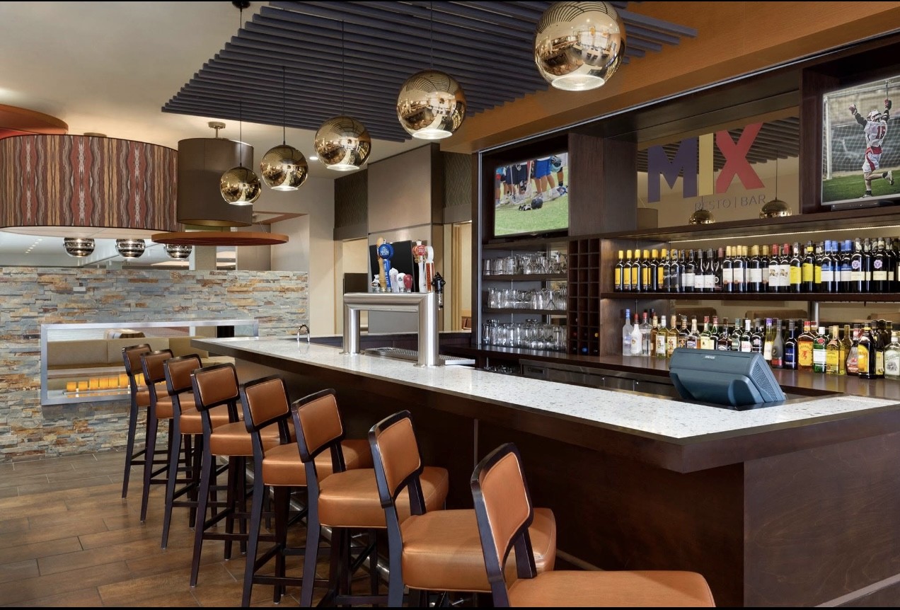 A vibrant bar scene with live music and cocktails.