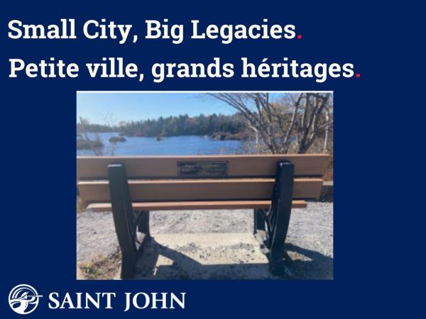 A park bench with a plaque as part of the Memorial Bench Program.