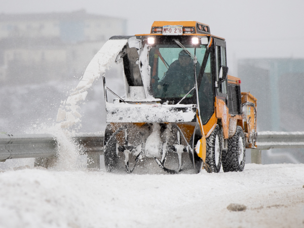 Sidewalk snow plow operating in Saint John