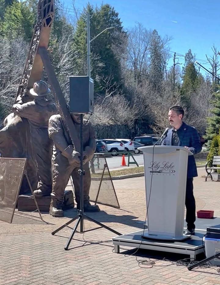 Tyler Embree speaking at the National Day of Mourning event