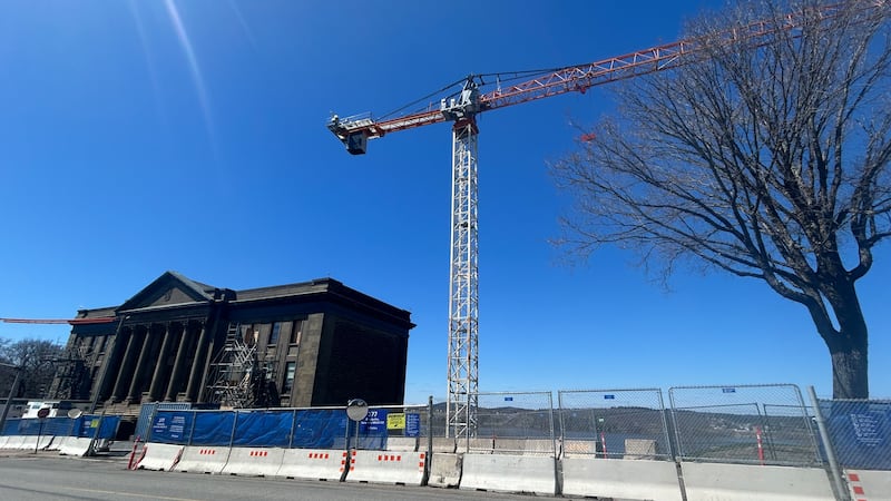 A crane is pictured beside the New Brunswick Museum in Saint John