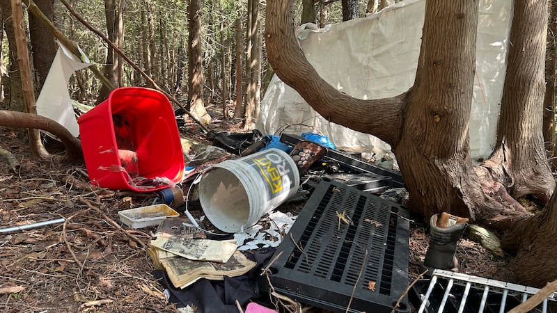 Debris from an encampment on part of Megan Goguen property is pictured