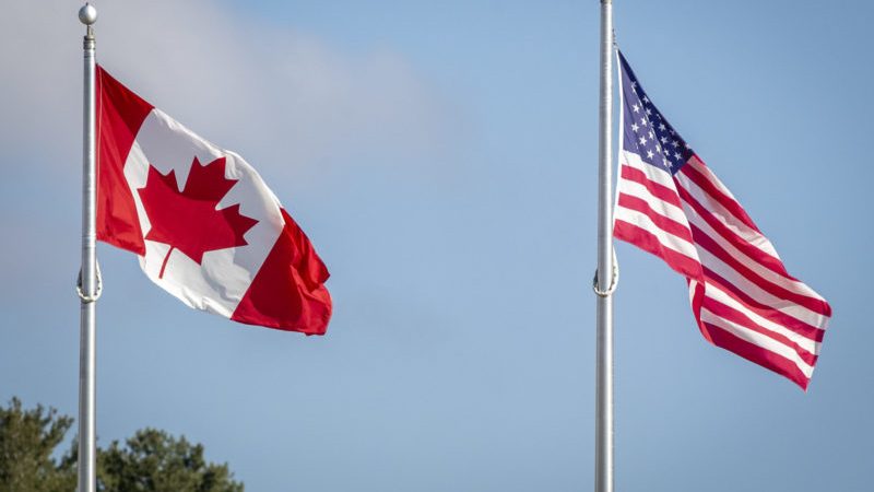 American and Canadian flags at the border