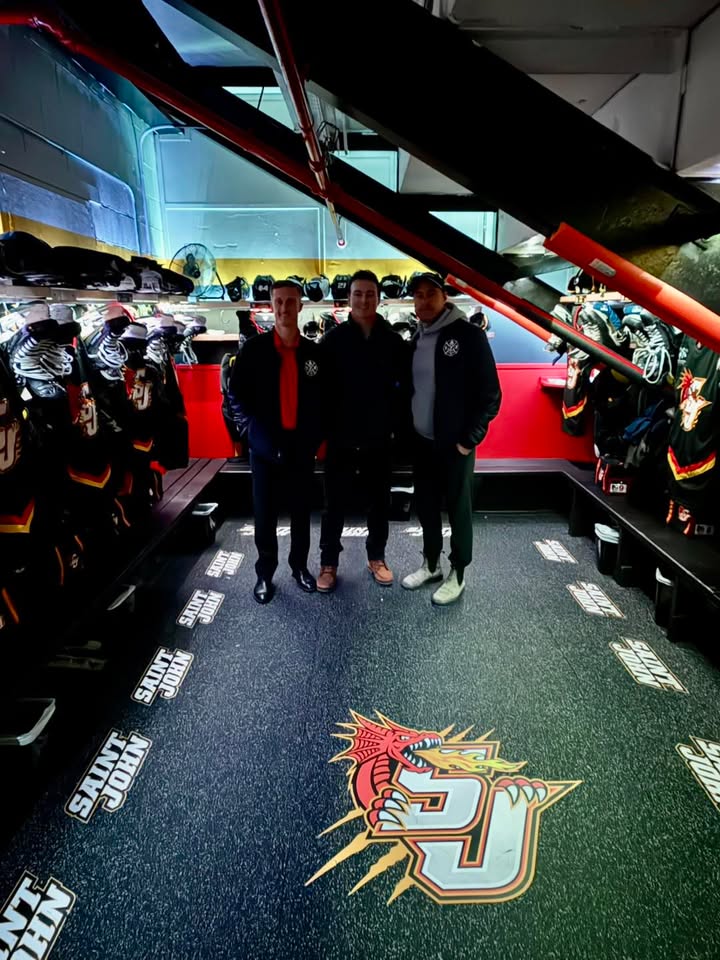 Saint John Firefighters meeting with Flames player Drew Johnston